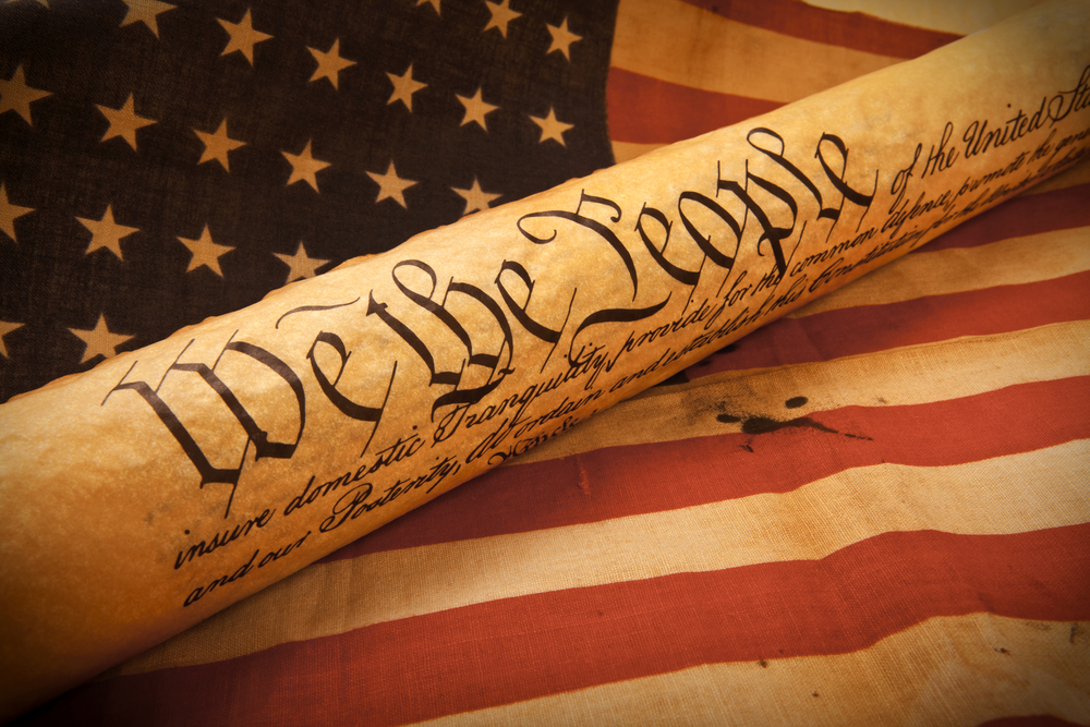Image of the First Amendment text on aged parchment paper, symbolizing the foundation of American freedoms.